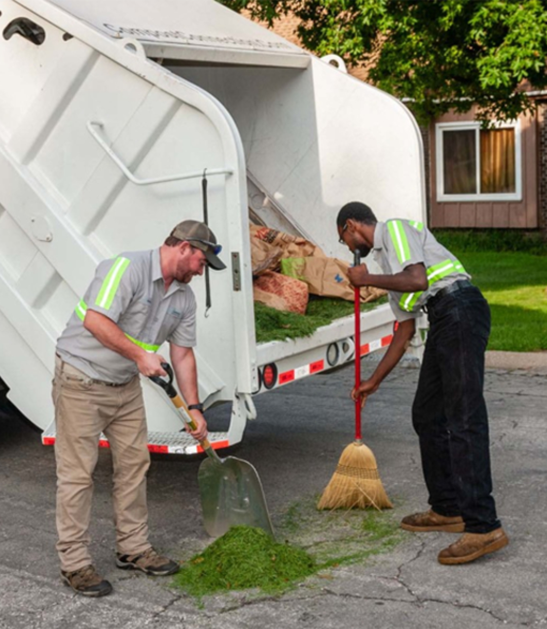 compost connection team sweeping leaves