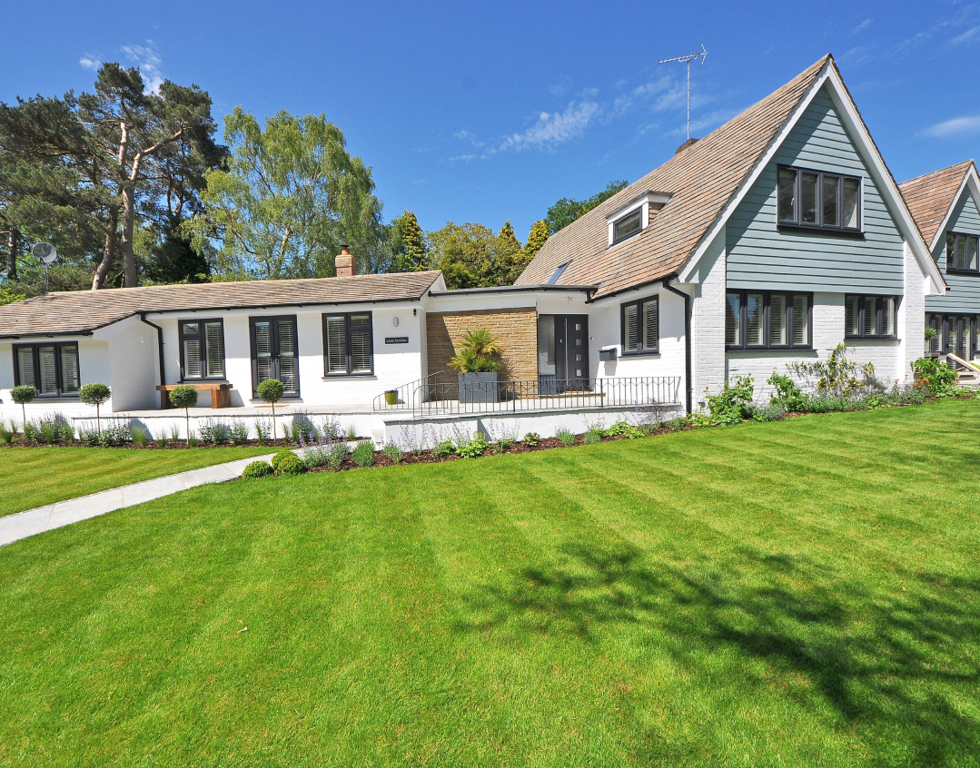 house with a newly mowed lawn